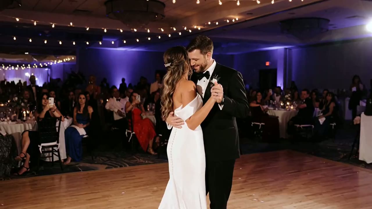 Wedding reception dance floor packed with guests under blue uplighting in Chicago