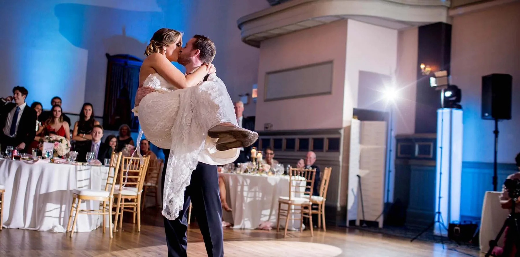 Groom carrying his bride during a Chicago wedding reception