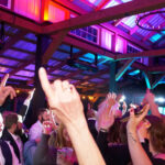 Hands up in the air as guests dance the night away on thedance floor at Harpor's Vineyard in New Virgina, Iowa, with music provided by DJ Paul Michaels from Paul Michaels Events