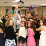 A group of people at a Bar Mitzvah celebration enjoying the best Bar Mitzvah DJ services by Paul Michaels Events
