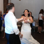 Bride and groom dancing and having the time of their lives