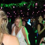 Bride and groom in the middle of the dance floor dancing to the beats of the best Chicago DJ wedding company