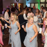 A bride and her guests on the dance floor at White Tail Ridge Golf Club,