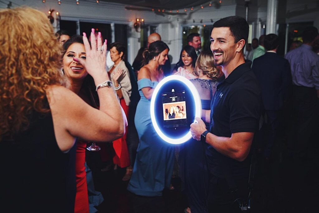Photobooth attendant with roaming photobooth