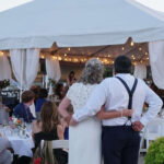 Bride and groom with arms around