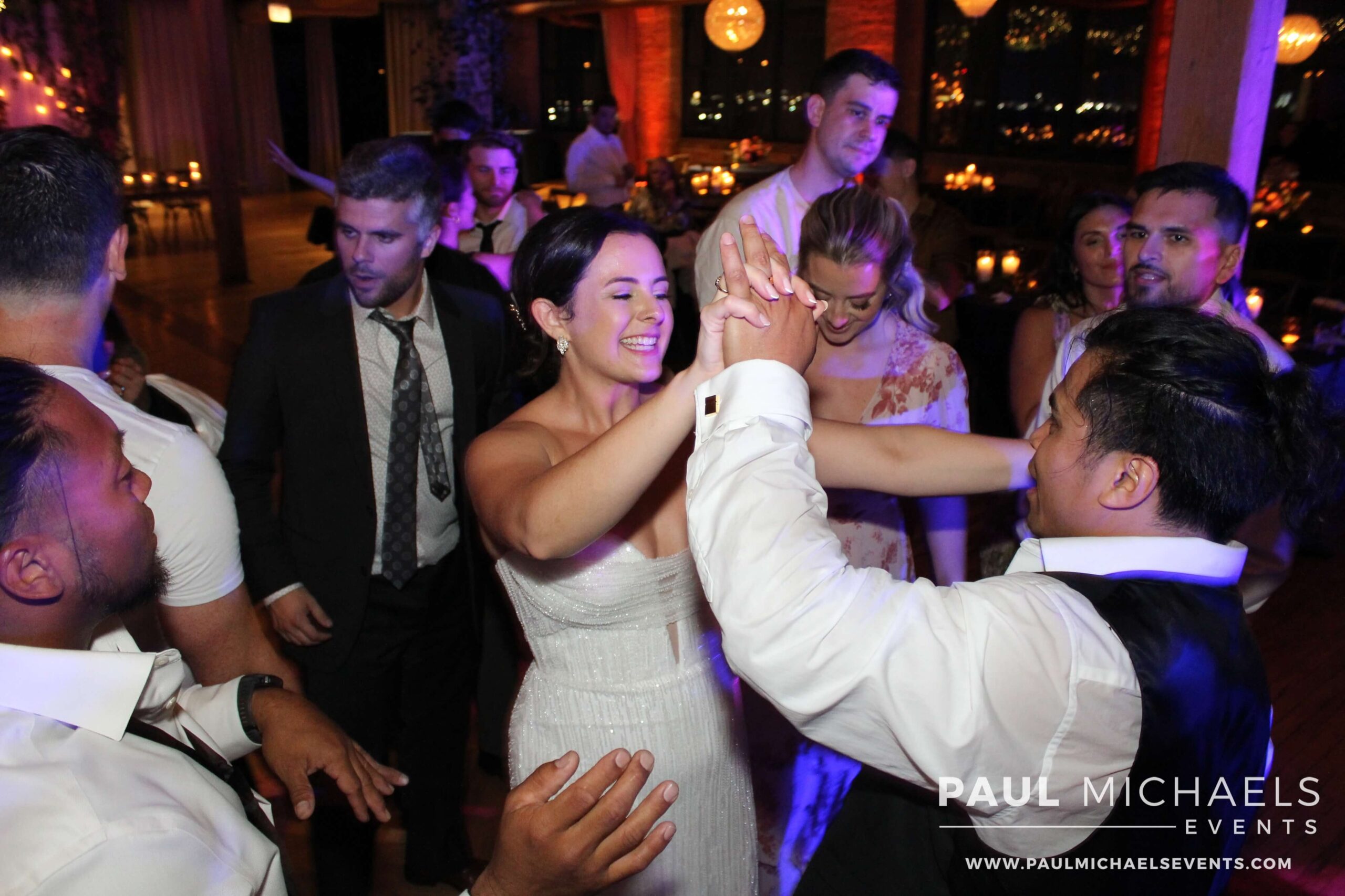 Bride and groom in the middle of the dance floor,