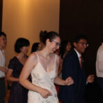 Bride and groom dancing with loved ones
