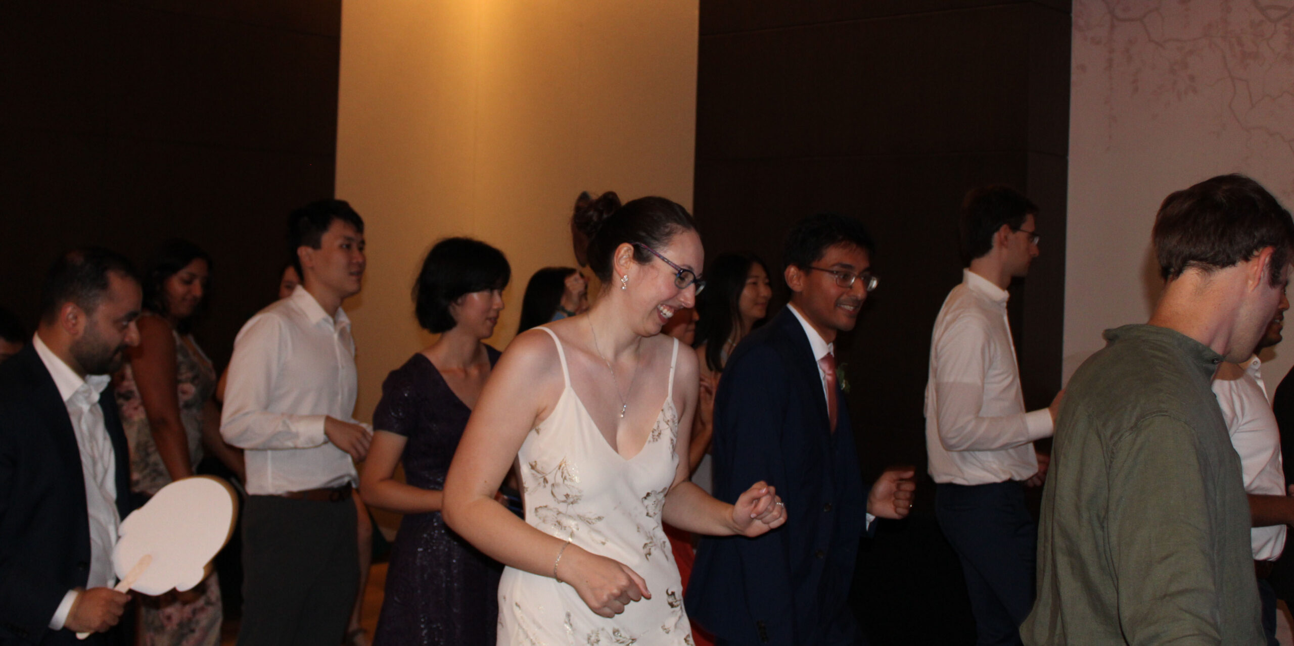 Bride and groom dancing with loved ones