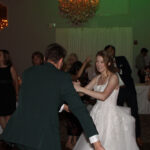 Bride and groom dancing to music