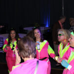 Group of people dressed in 80s themed attire