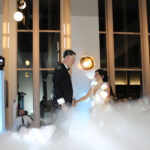 Bride and groom sharing their first dance, with music