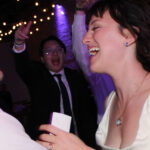 Bride and groom dancing to the best wedding DJ
