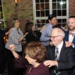 A group of people dancing at a Jewish wedding