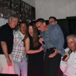 Group of people singing karaoke with music a