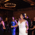 Bride and guests dancing to music by the best Chicagoland DJ company, Paul Michaels Events